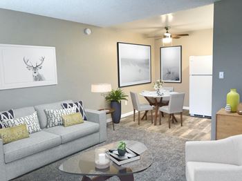 A living room and dining room with a couch and a table